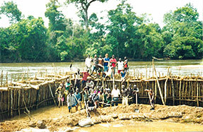 Blocking the river in order to dig diamonds